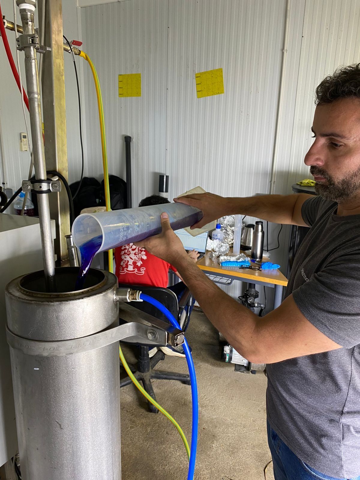 An operator charging the extraction vessel in the plant